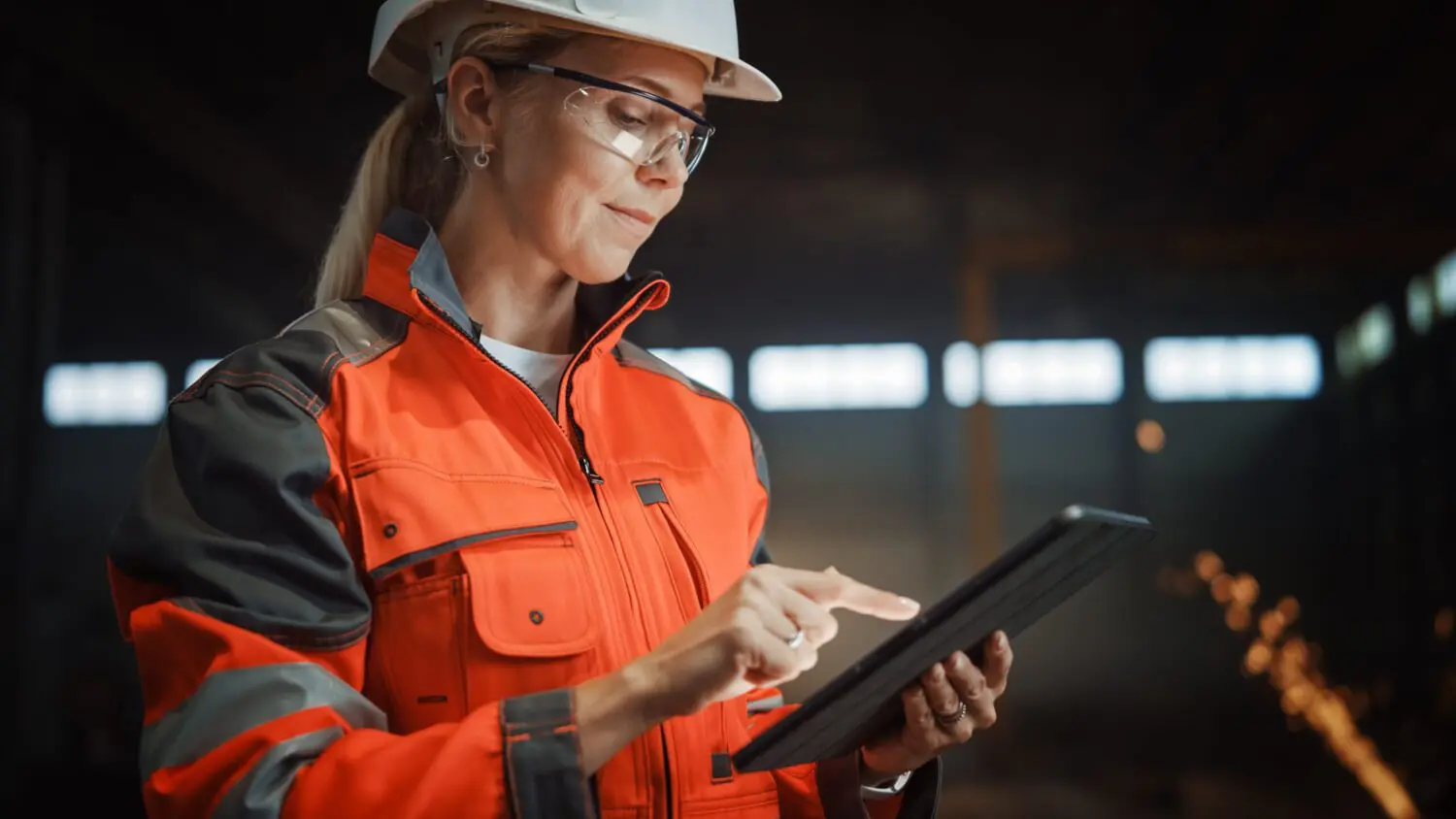 Person on iPad in factory